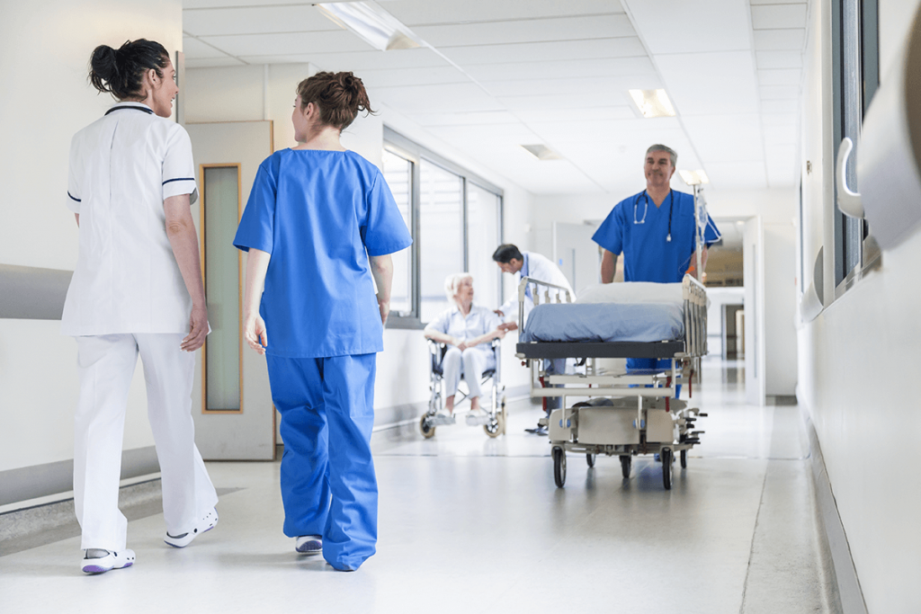 male nurse pushing stretcher gurney bed